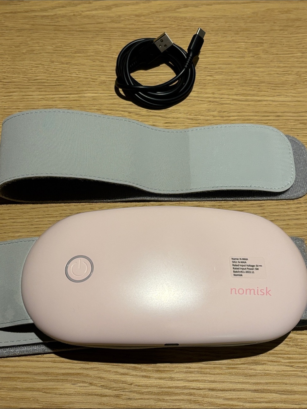 Nomisk Pink Portable Massager/ Heat pad with Grey Strap